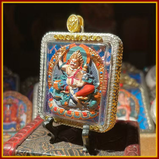 This is a Buddha amulet made of clay by artisans on the roof of the world, fired at high temperatures, and then hand-painted with mineral pigments. Its name is White Jambhala.