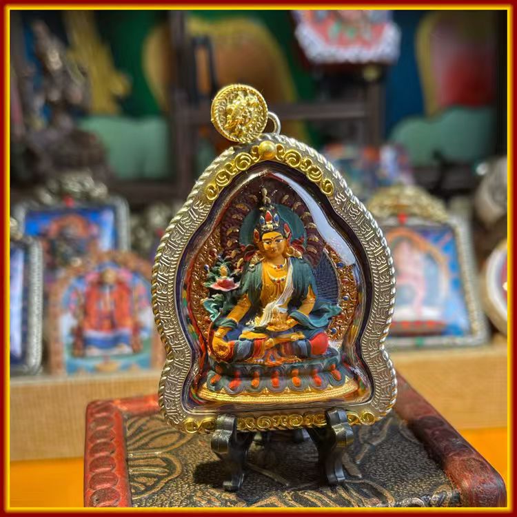 This is a Buddha amulet made of clay by artisans on the roof of the world, fired at high temperatures, and then hand-painted with mineral pigments. Its name is Ksitigarbha Bodhisattva.