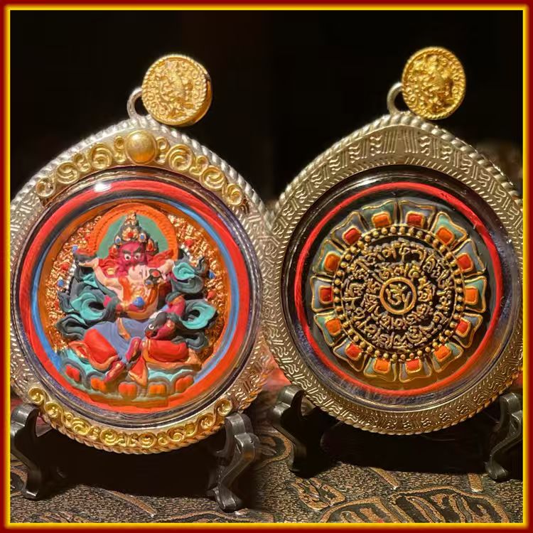 These are amulets made of clay by artisans on the roof of the world, fired at high temperatures and hand-painted with mineral pigments. His name is Red Jambhala.