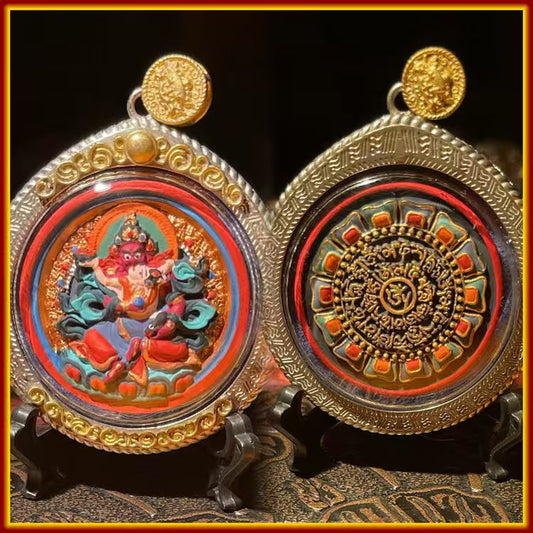 These are amulets made of clay by artisans on the roof of the world, fired at high temperatures and hand-painted with mineral pigments. His name is Red Jambhala.