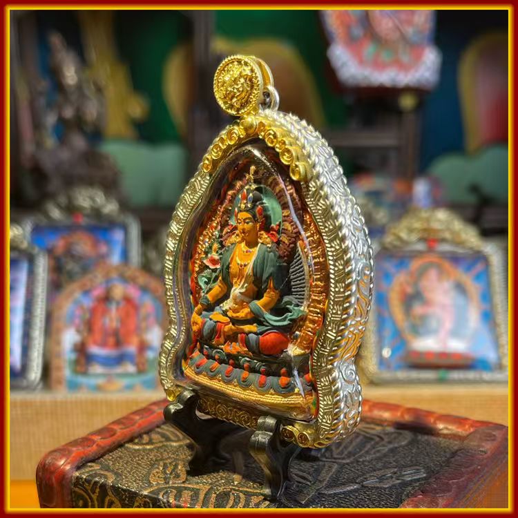 This is a Buddha amulet made of clay by artisans on the roof of the world, fired at high temperatures, and then hand-painted with mineral pigments. Its name is Ksitigarbha Bodhisattva.