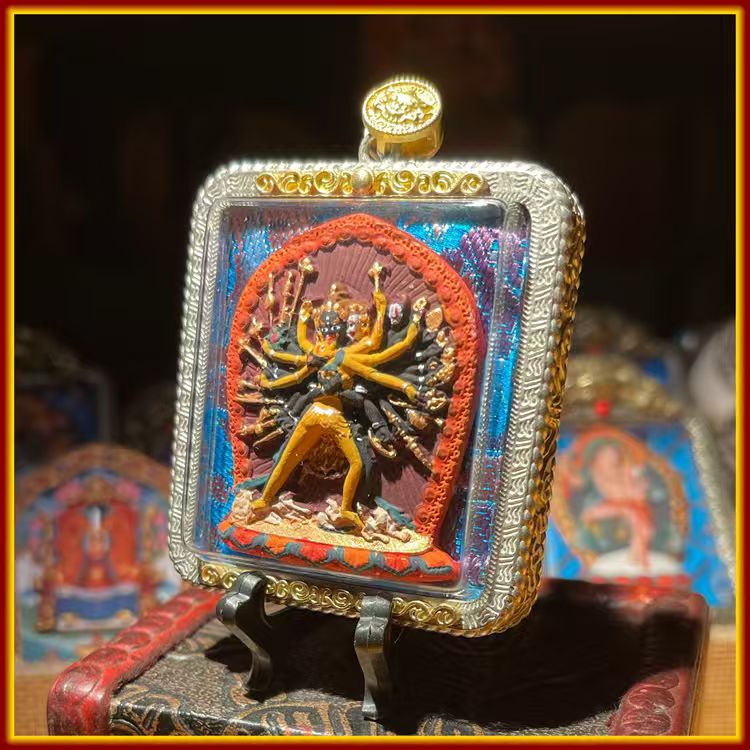 This is a Buddha amulet made of clay by artisans on the roof of the world, fired at high temperatures, and then hand-painted with mineral pigments. Its name is Chakrasamvara.