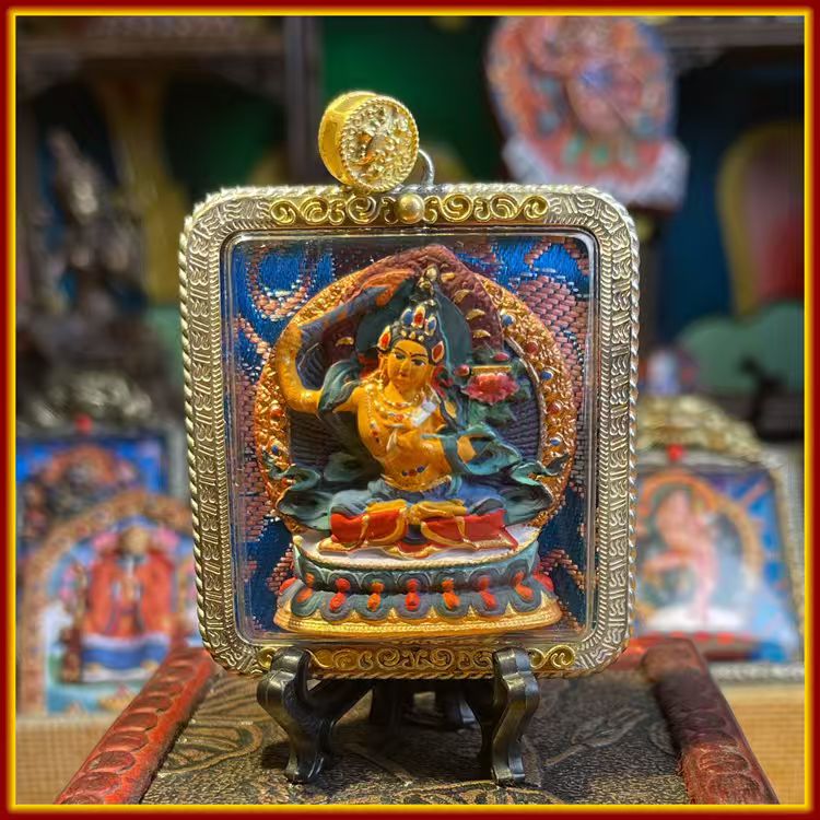 This is a Buddha amulet made of clay by artisans on the roof of the world, fired at high temperatures, and then hand-painted with mineral pigments. Its name is Manjushri Bodhisattva.