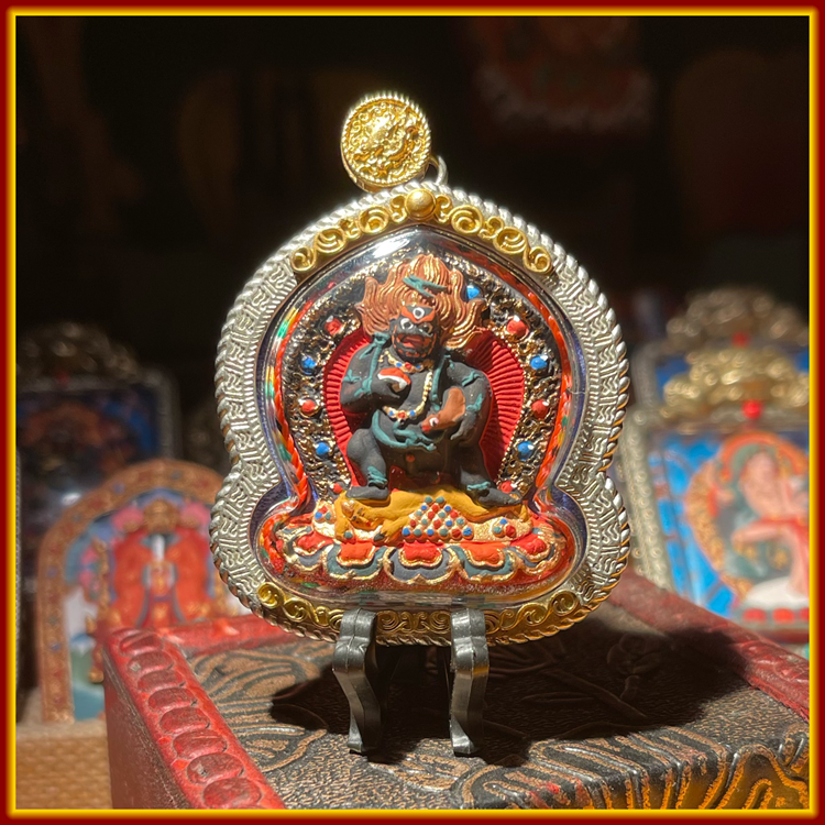 This is a Buddha amulet made of clay by artisans on the roof of the world, fired at high temperatures, and hand-painted with mineral pigments. Its name is Black Jambhala.