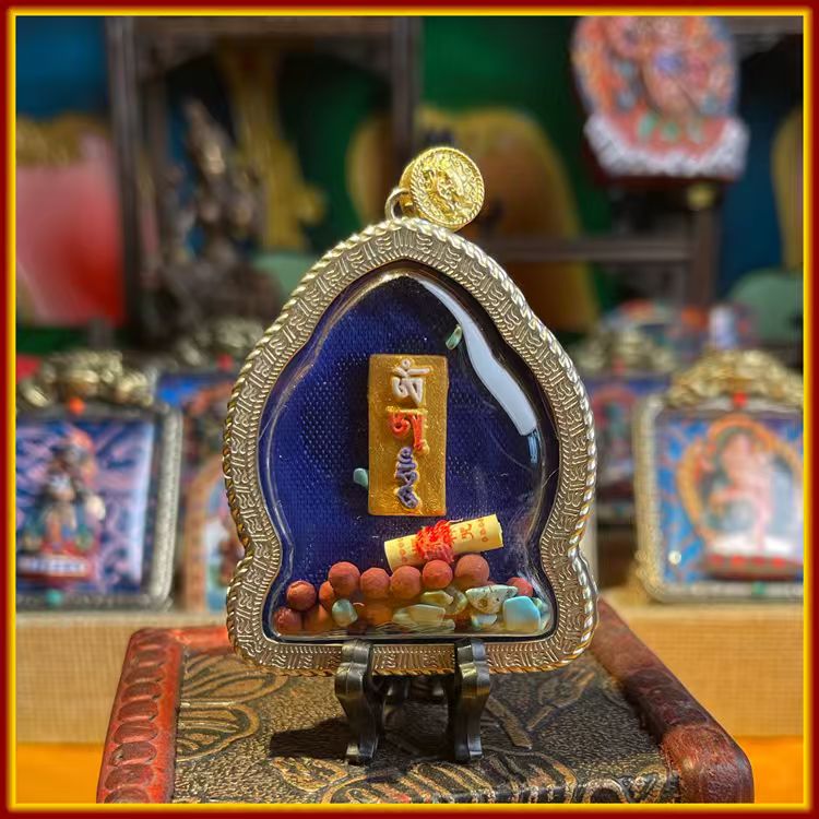 This is a Buddha amulet made of clay by artisans on the roof of the world, fired at high temperatures, and hand-painted with mineral pigments. Its name is Akshobhya Buddha.