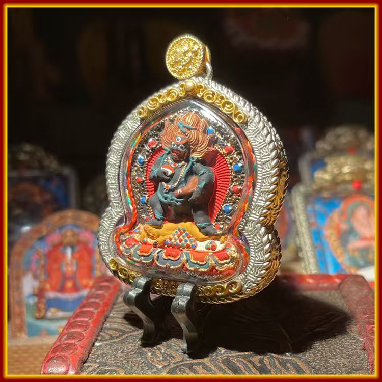 This is a Buddha amulet made of clay by artisans on the roof of the world, fired at high temperatures, and hand-painted with mineral pigments. Its name is Black Jambhala.