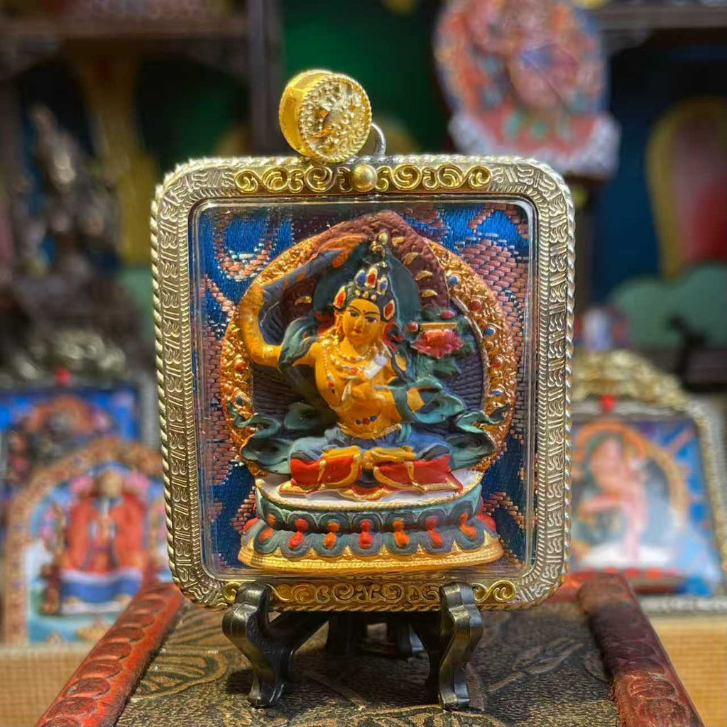 This is a Buddha amulet made of clay by artisans on the roof of the world, fired at high temperatures, and then hand-painted with mineral pigments. Its name is Manjushri Bodhisattva.