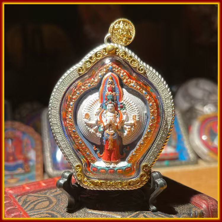 This is a Buddhist amulet made of clay by artisans on the roof of the world, fired at high temperatures, and then hand-painted with mineral pigments. Its name is Thousand-Armed Guanyin.