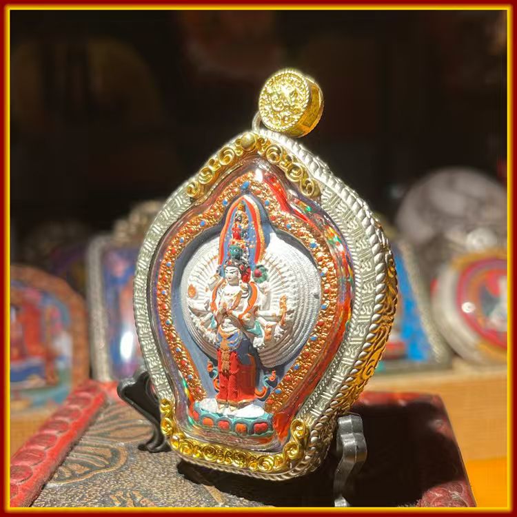 This is a Buddhist amulet made of clay by artisans on the roof of the world, fired at high temperatures, and then hand-painted with mineral pigments. Its name is Thousand-Armed Guanyin.