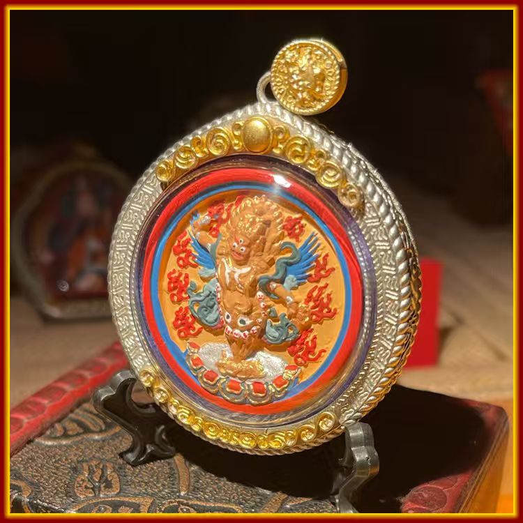 This is a Buddhist amulet made of clay by artisans on the roof of the world, fired at high temperatures, and hand-painted with mineral pigments. Its name is Vajrakilaya.