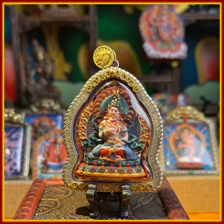 This is a Buddhist amulet made of clay by artisans on the roof of the world. It was fired at high temperatures and then hand-painted with mineral pigments. Its name is Vajrasattva Bodhisattva.