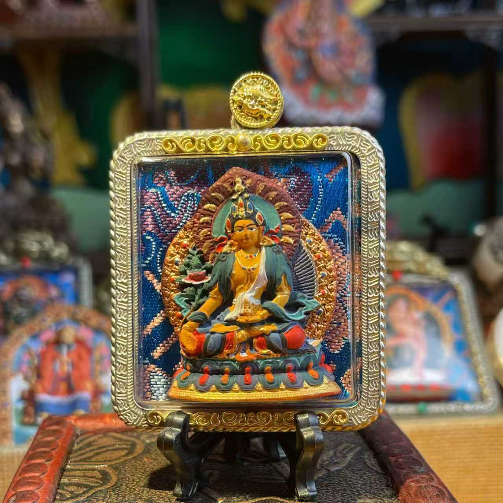 This is a Buddha amulet made of clay by artisans on the roof of the world. It was fired at high temperatures and then hand-painted with mineral pigments. Its name is Ksitigarbha Bodhisattva.
