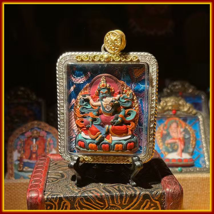 This is a Buddha amulet made of clay by artisans on the roof of the world, fired at high temperatures, and hand-painted with mineral pigments. Its name is Green Tara.