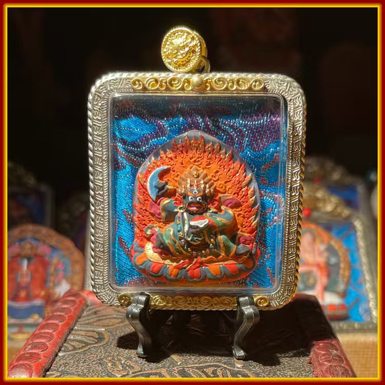 This is a Buddhist amulet made of clay by artisans on the roof of the world, fired at high temperatures, and then hand-painted with mineral pigments. Its name is Black Robe Vajra.