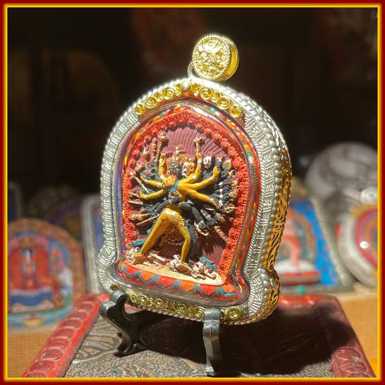 These are amulets made of clay by artisans on the roof of the world, fired at high temperatures, and hand-painted with mineral pigments. They are called Kalachakra amulets.