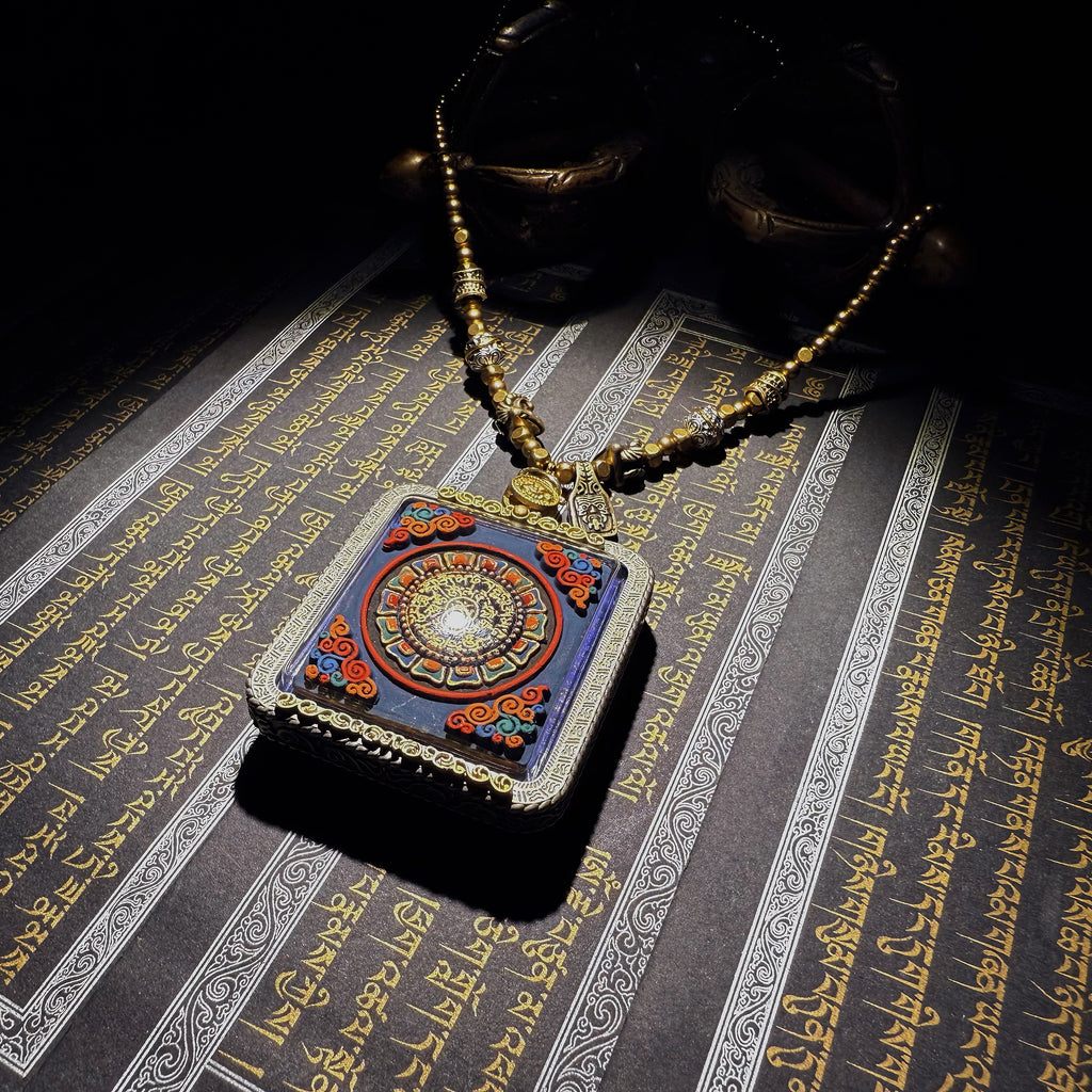 Tibetan amulet – handmade. Dzi bead necklace, bracelet, thangka, and ritual implements – this amulet is handcrafted by Tibetan artisans and meticulously painted with natural mineral pigments. No two are exactly alike.