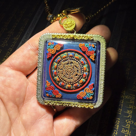 Tibetan amulet – handmade. Dzi bead necklace, bracelet, thangka, and ritual implements – this amulet is handcrafted by Tibetan artisans and meticulously painted with natural mineral pigments. No two are exactly alike.