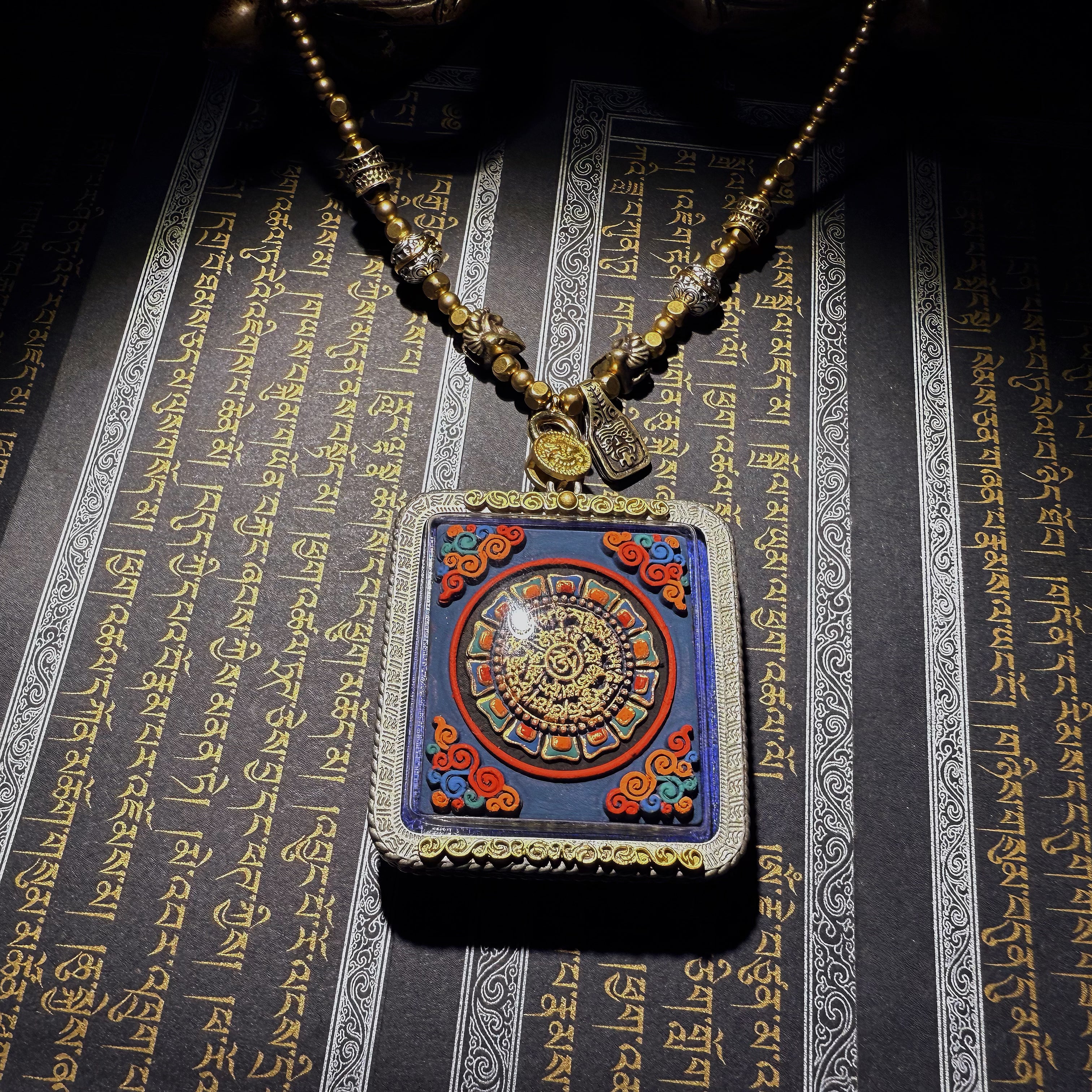 Tibetan amulet – handmade. Dzi bead necklace, bracelet, thangka, and ritual implements – this amulet is handcrafted by Tibetan artisans and meticulously painted with natural mineral pigments. No two are exactly alike.