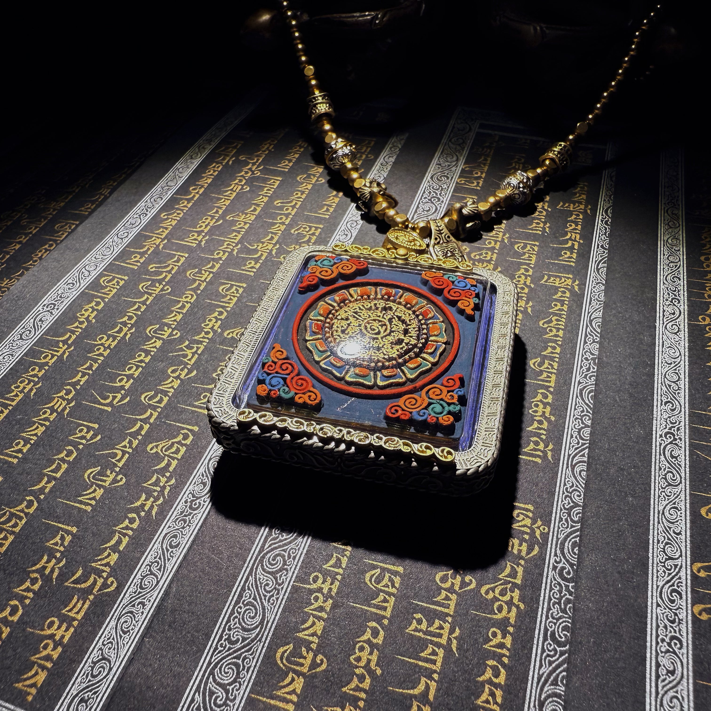 Tibetan amulet – handmade. Dzi bead necklace, bracelet, thangka, and ritual implements – this amulet is handcrafted by Tibetan artisans and meticulously painted with natural mineral pigments. No two are exactly alike.