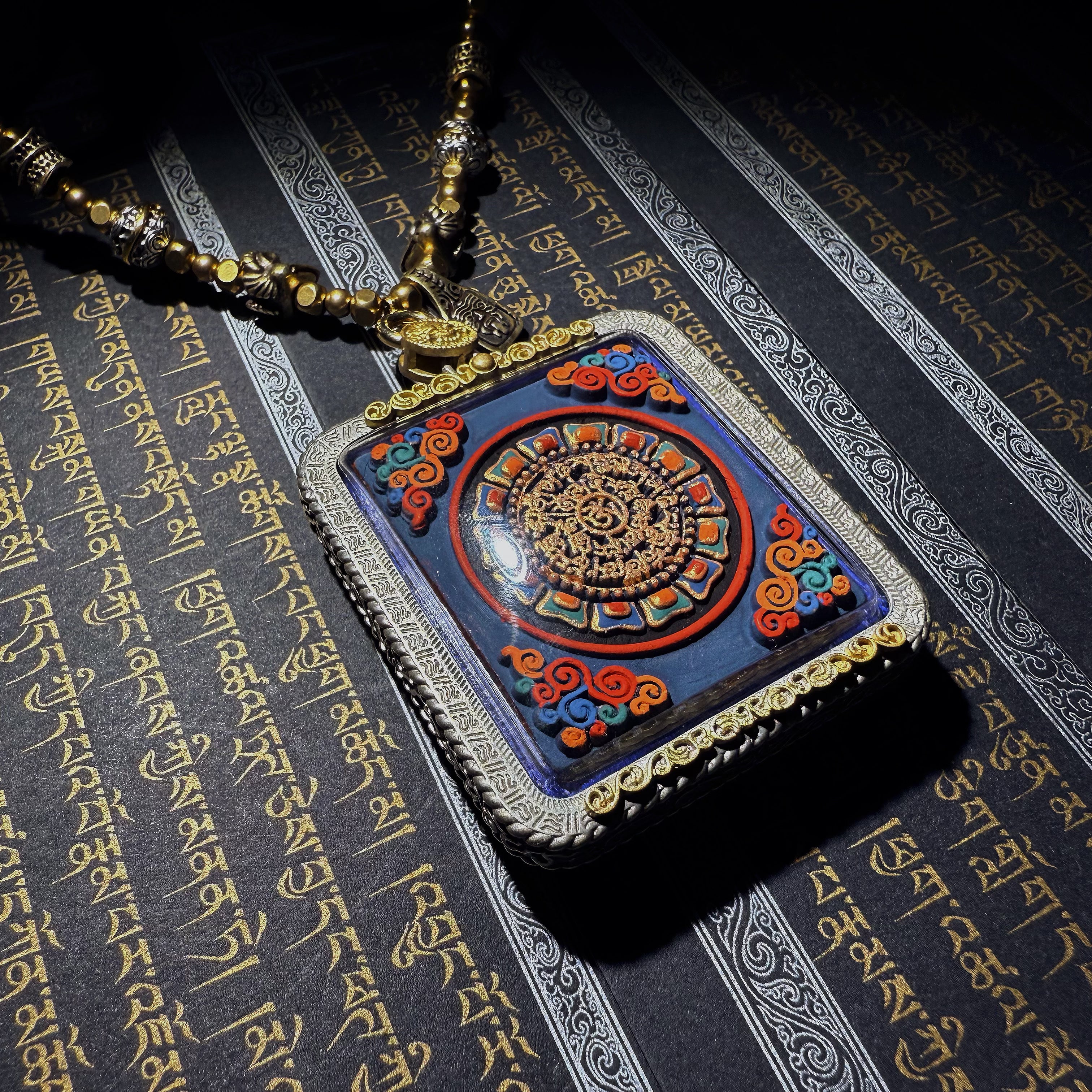 Tibetan amulet – handmade. Dzi bead necklace, bracelet, thangka, and ritual implements – this amulet is handcrafted by Tibetan artisans and meticulously painted with natural mineral pigments. No two are exactly alike.
