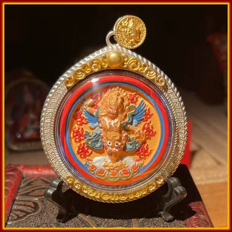 This is a Buddhist amulet made of clay by artisans on the roof of the world, fired at high temperatures, and hand-painted with mineral pigments. Its name is Vajrakilaya.