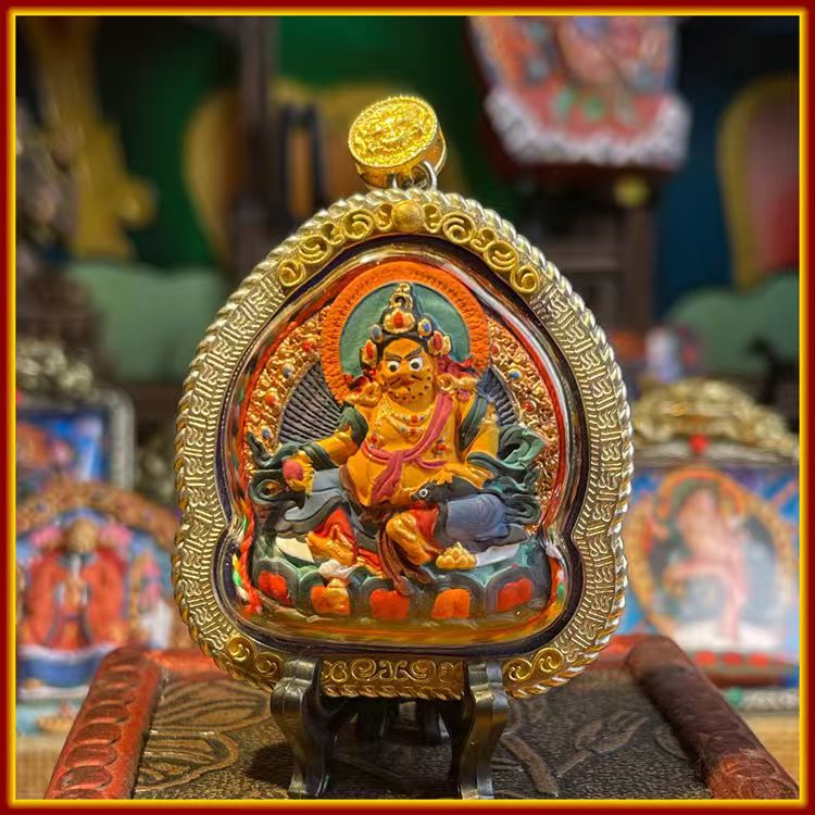This is a Buddha amulet made of clay by artisans on the roof of the world, fired at high temperatures, and hand-painted with mineral pigments. Its name is Yellow Jambhala.