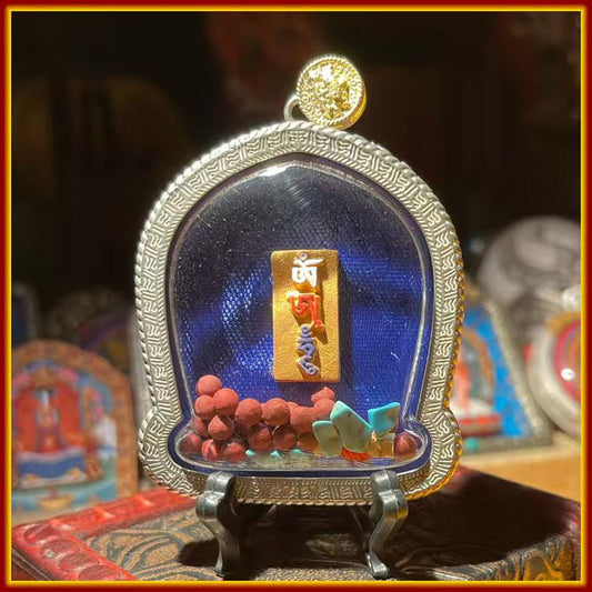 These are amulets made of clay by artisans on the roof of the world, fired at high temperatures, and hand-painted with mineral pigments. They are called Kalachakra amulets.
