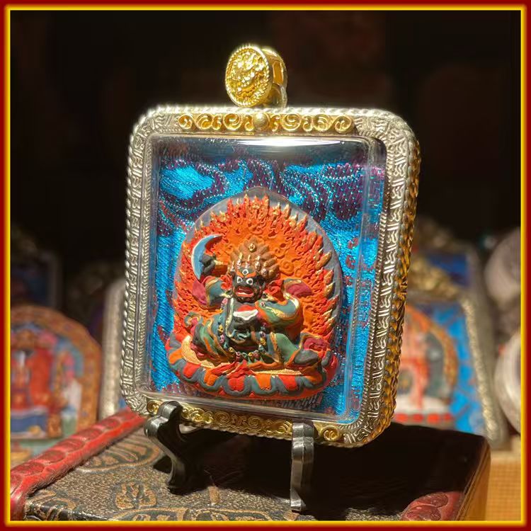 This is a Buddhist amulet made of clay by artisans on the roof of the world, fired at high temperatures, and then hand-painted with mineral pigments. Its name is Black Robe Vajra.