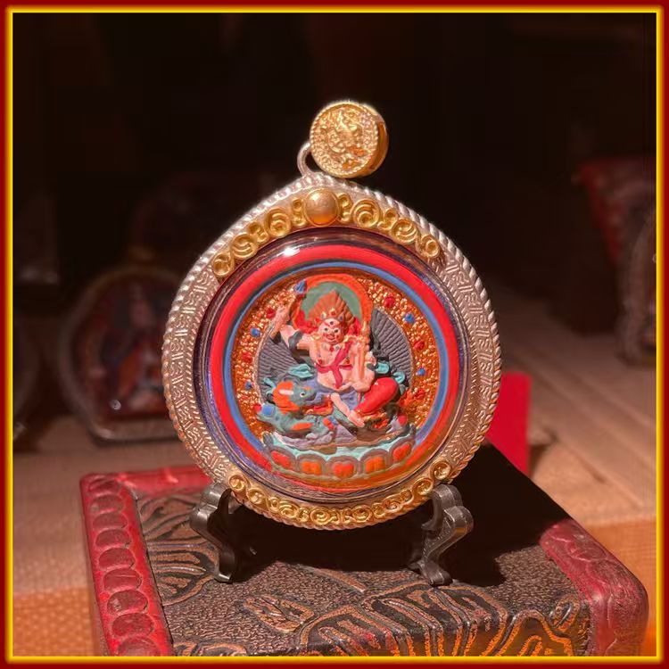 These are amulets made of clay by artisans on the roof of the world, fired at high temperatures, and then hand-painted with mineral pigments. His name is White Jambhala.