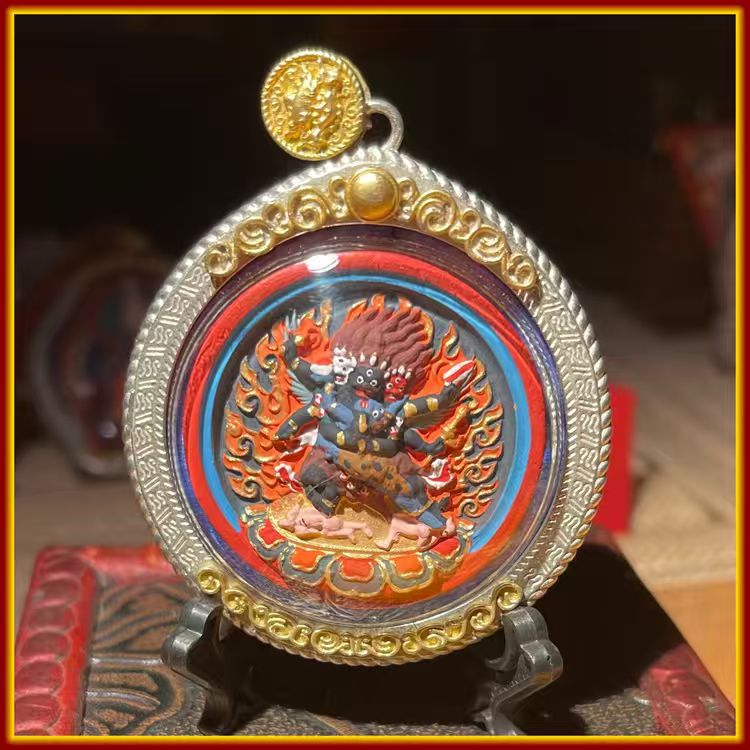 This is a Buddhist amulet made of clay by artisans on the roof of the world, fired at high temperatures, and hand-painted with mineral pigments. Its name is Vajrakilaya.