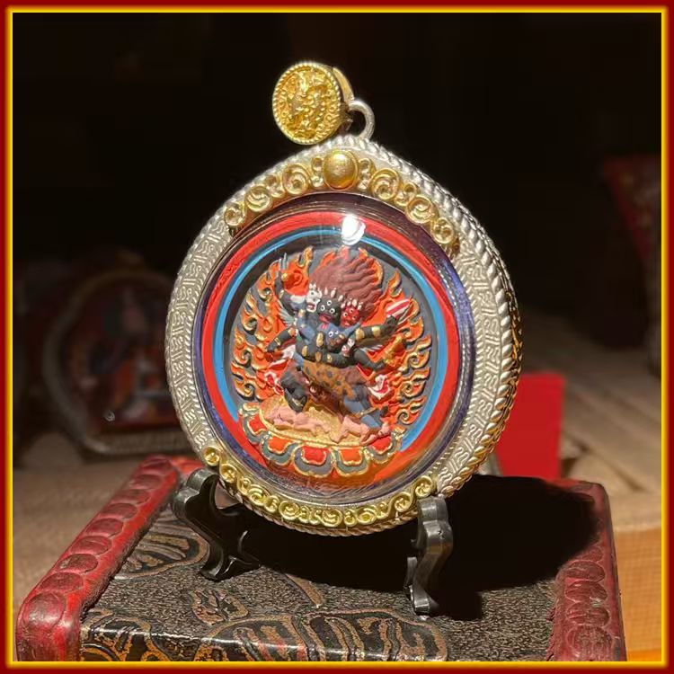 This is a Buddhist amulet made of clay by artisans on the roof of the world, fired at high temperatures, and hand-painted with mineral pigments. Its name is Vajrakilaya.
