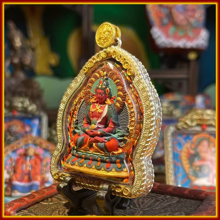 These are Buddha amulets made of clay by artisans on the roof of the world, fired at high temperatures and hand-painted with mineral pigments. His name is Amitayus (Buddha of Longevity).