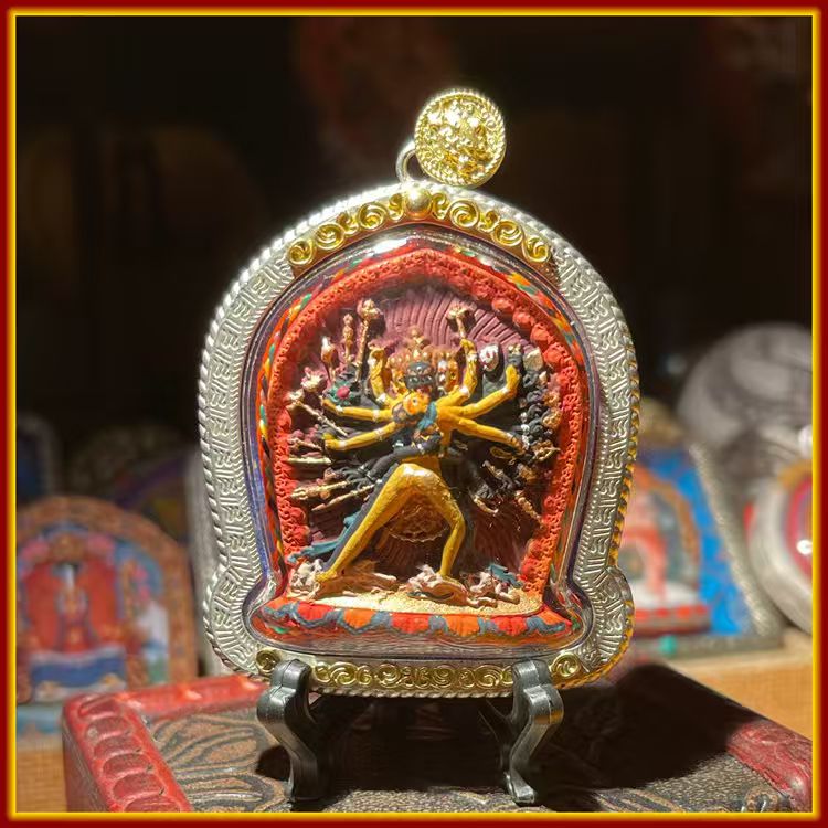These are amulets made of clay by artisans on the roof of the world, fired at high temperatures, and hand-painted with mineral pigments. They are called Kalachakra amulets.