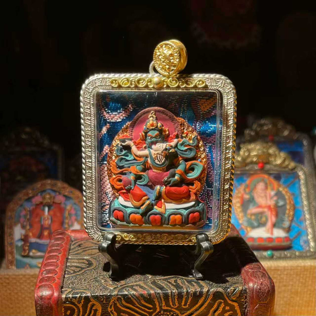 This is a Buddha amulet made of clay by artisans on the roof of the world, fired at high temperatures, and hand-painted with mineral pigments. Its name is Green Tara.