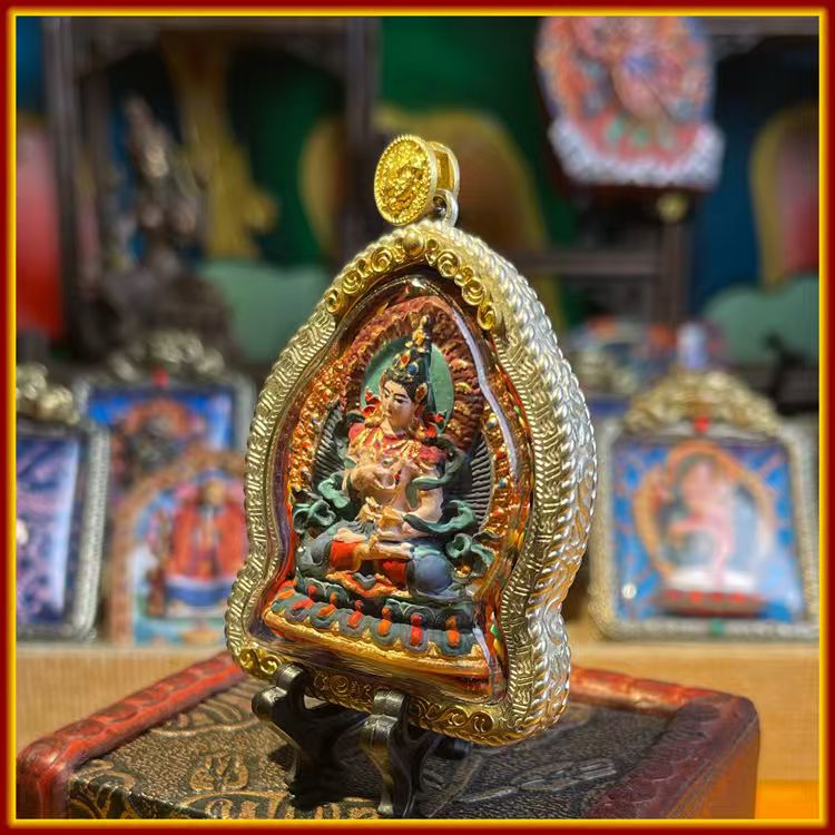This is a Buddhist amulet made of clay by artisans on the roof of the world. It was fired at high temperatures and then hand-painted with mineral pigments. Its name is Vajrasattva Bodhisattva.