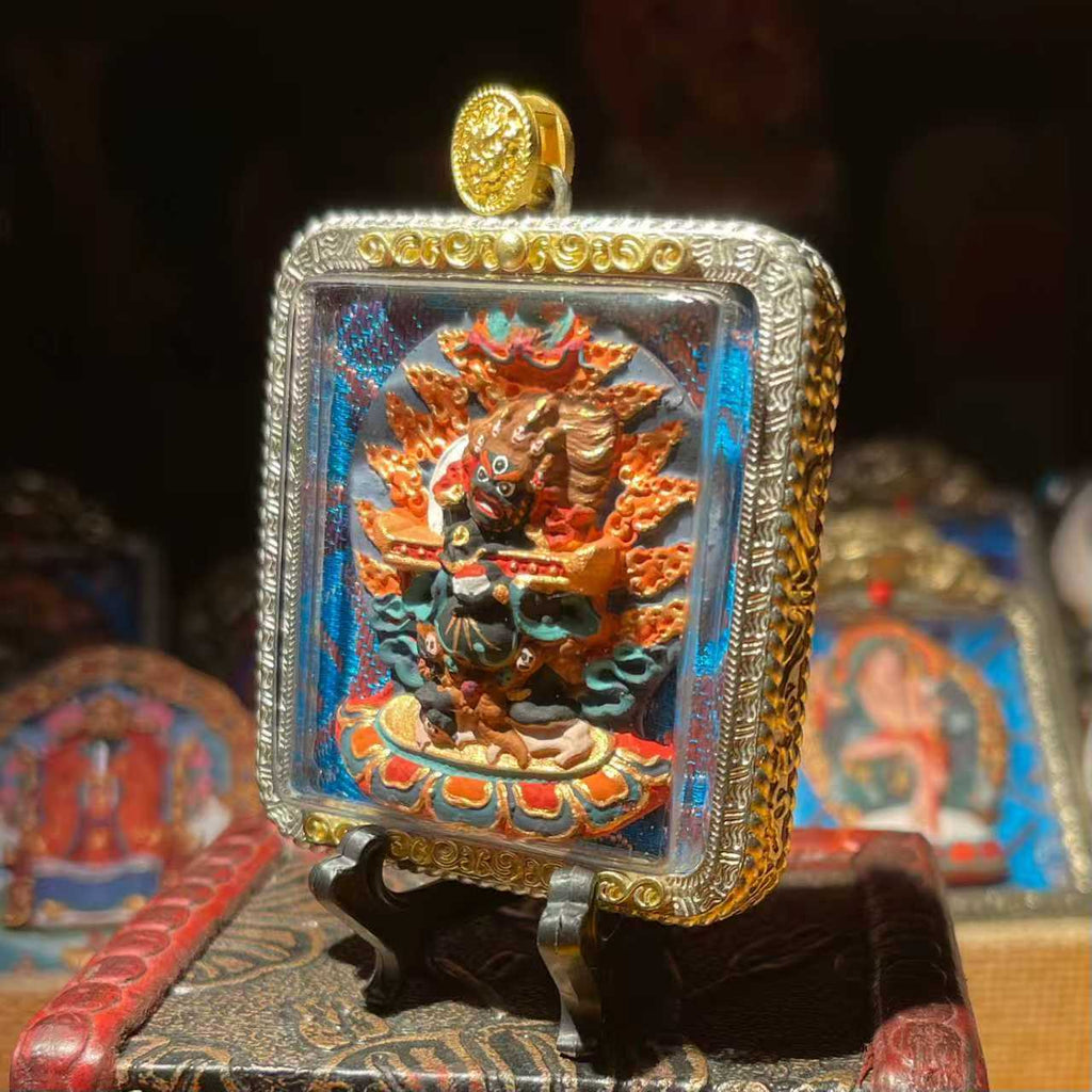 This is a Buddhist amulet made of clay by artisans on the roof of the world. After being fired at high temperatures, it was then hand-painted with mineral pigments. Its name is "Two-Armed Mahakala".