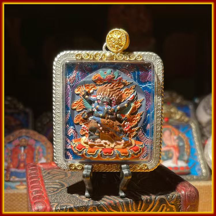 This is a Buddhist amulet made of clay by artisans on the roof of the world, fired at high temperatures, and then hand-painted with mineral pigments. Its name is Vajrakilaya.