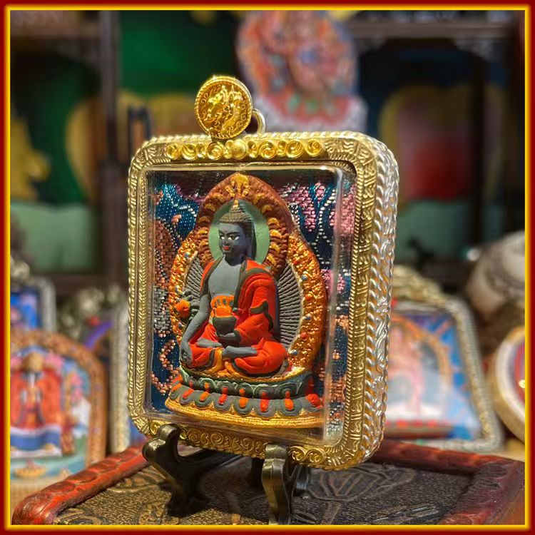 This is a Buddha amulet made of clay by artisans on the roof of the world, fired at high temperatures, and then hand-painted with mineral pigments. Its name is Medicine Buddha.