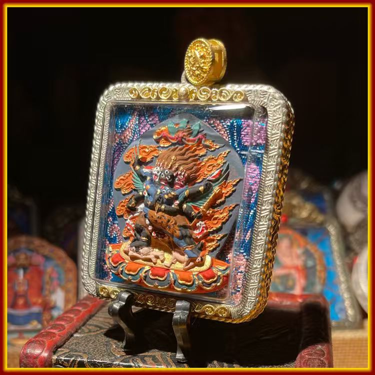 This is a Buddhist amulet made of clay by artisans on the roof of the world, fired at high temperatures, and then hand-painted with mineral pigments. Its name is Vajrakilaya.