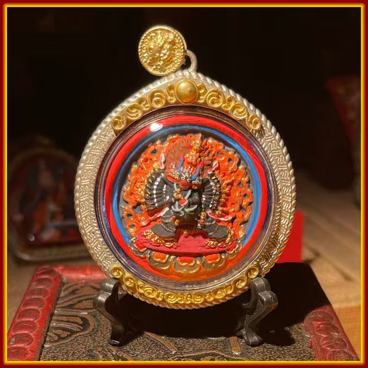 This is a Buddha amulet made of clay by artisans on the roof of the world, fired at high temperatures, and hand-painted with mineral pigments. Its name is Vajra Mahākāra.