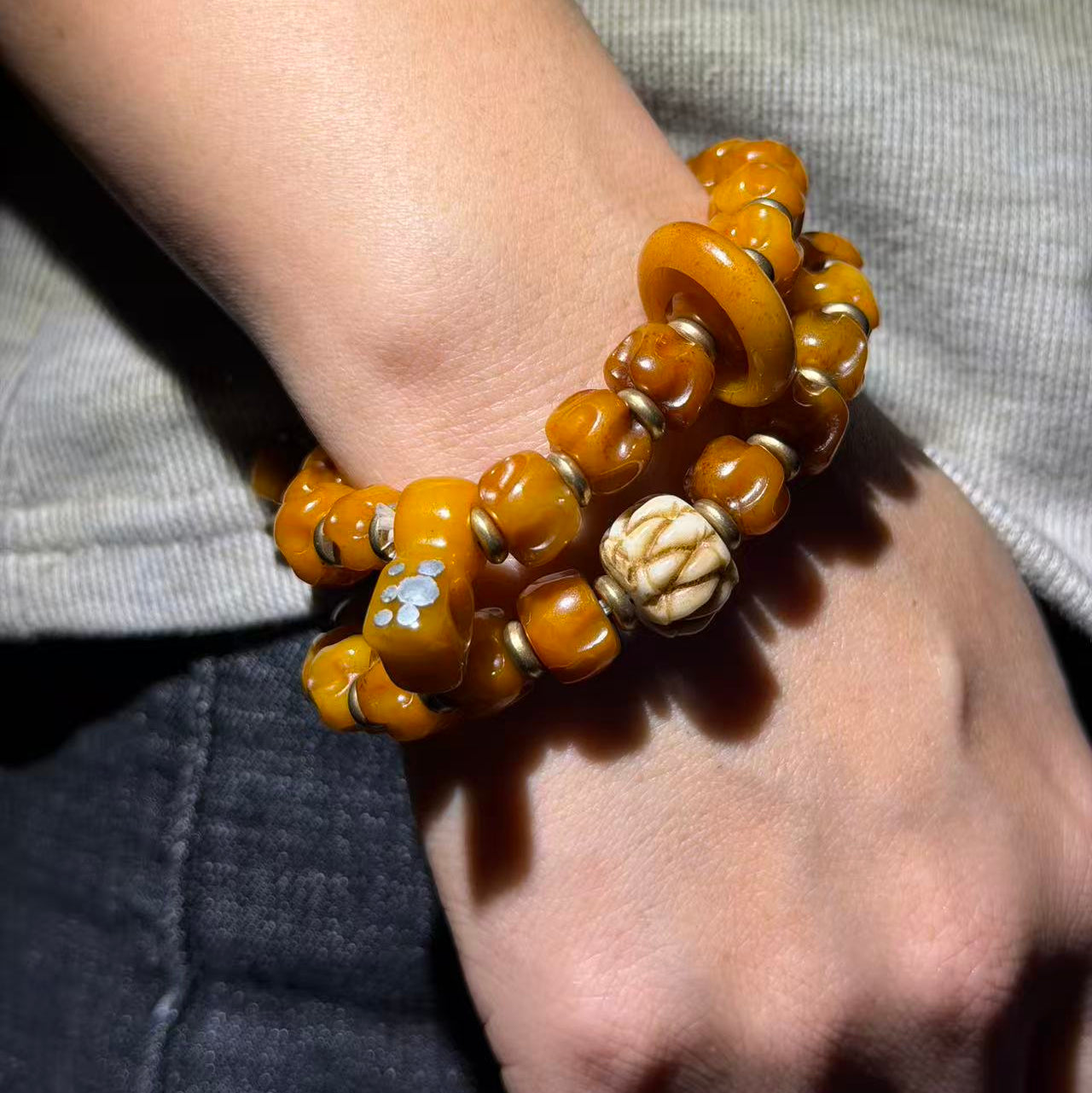This is a beautifully crafted bracelet made from yak bone by artisans on the roof of the world, showcasing your unique personality.