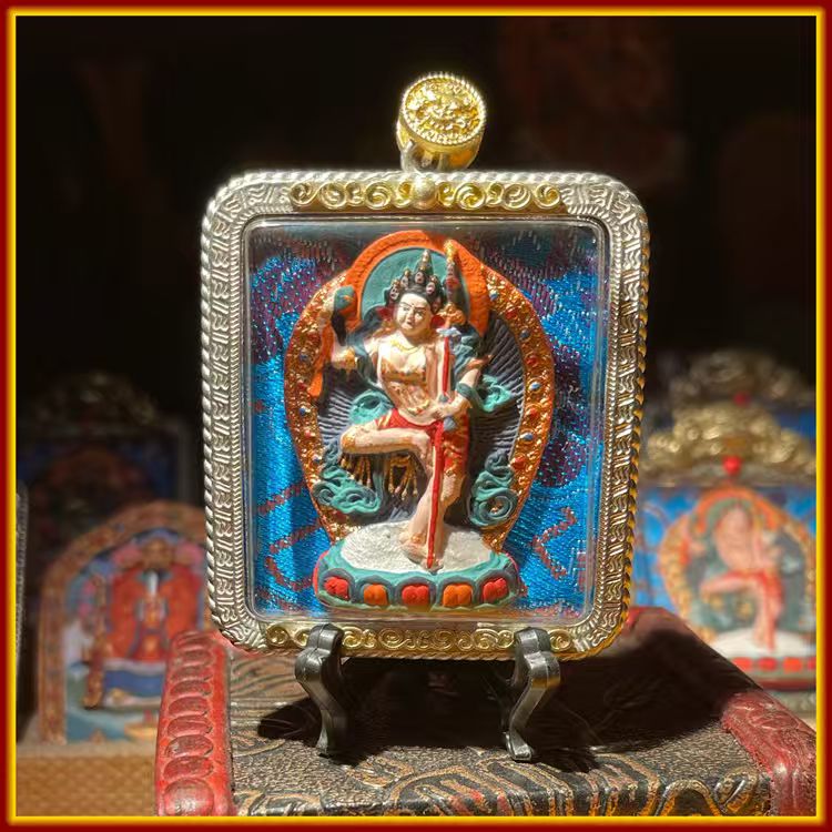 This is a Buddha amulet made of clay by artisans on the roof of the world, fired at high temperatures, and then hand-painted with mineral pigments. Its name is Machig Labdron.