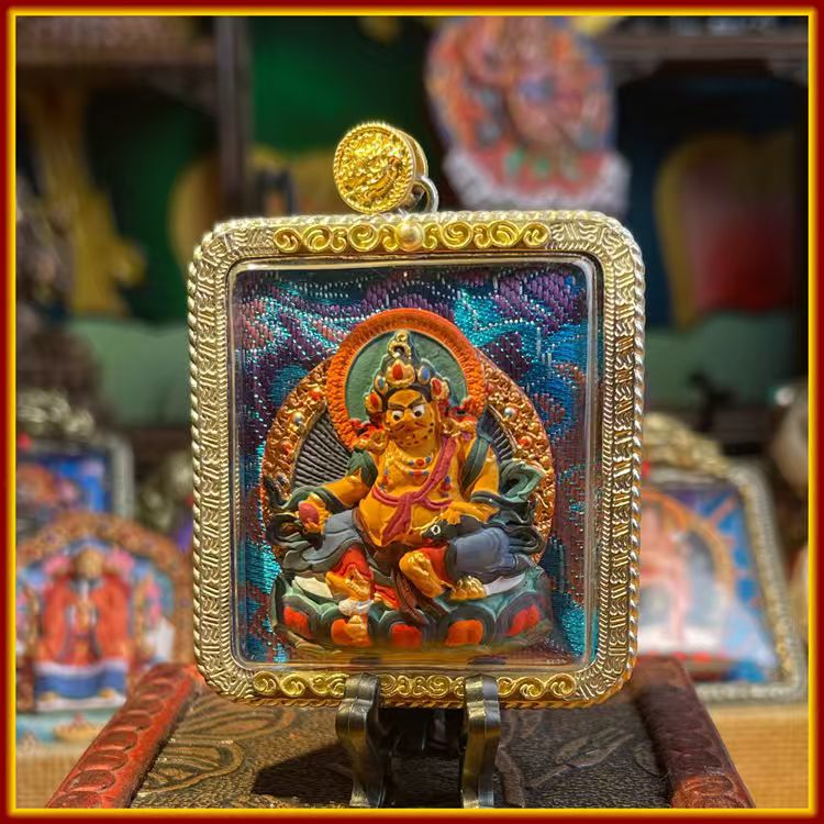 This is a Buddha amulet made of clay by artisans on the roof of the world, fired at high temperatures, and hand-painted with mineral pigments. Its name is Yellow Jambhala.