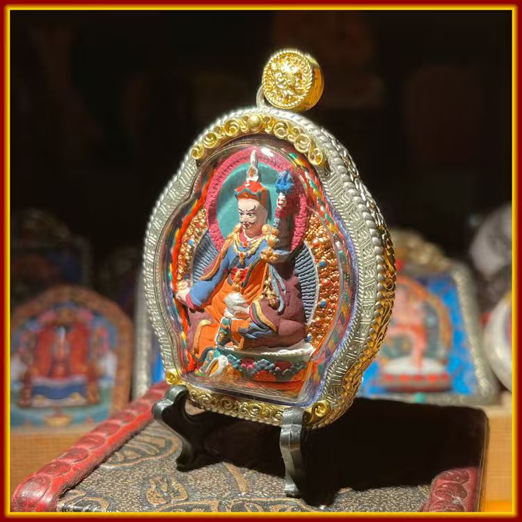 This is a Buddhist amulet made of clay by artisans on the roof of the world. It was fired at high temperatures and then hand-painted with mineral pigments. Its name is Padmasambhava.