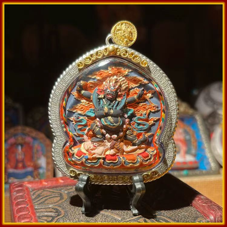 This is a Buddhist amulet made of clay by artisans on the roof of the world, fired at high temperatures, and then hand-painted with mineral pigments. Its name is the Four-Armed Vajra Subduing Demon Buddha.