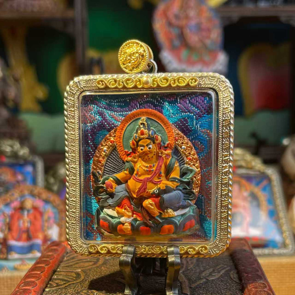 This is a Buddha amulet made of clay by artisans on the roof of the world, fired at high temperatures, and hand-painted with mineral pigments. Its name is Yellow Jambhala.