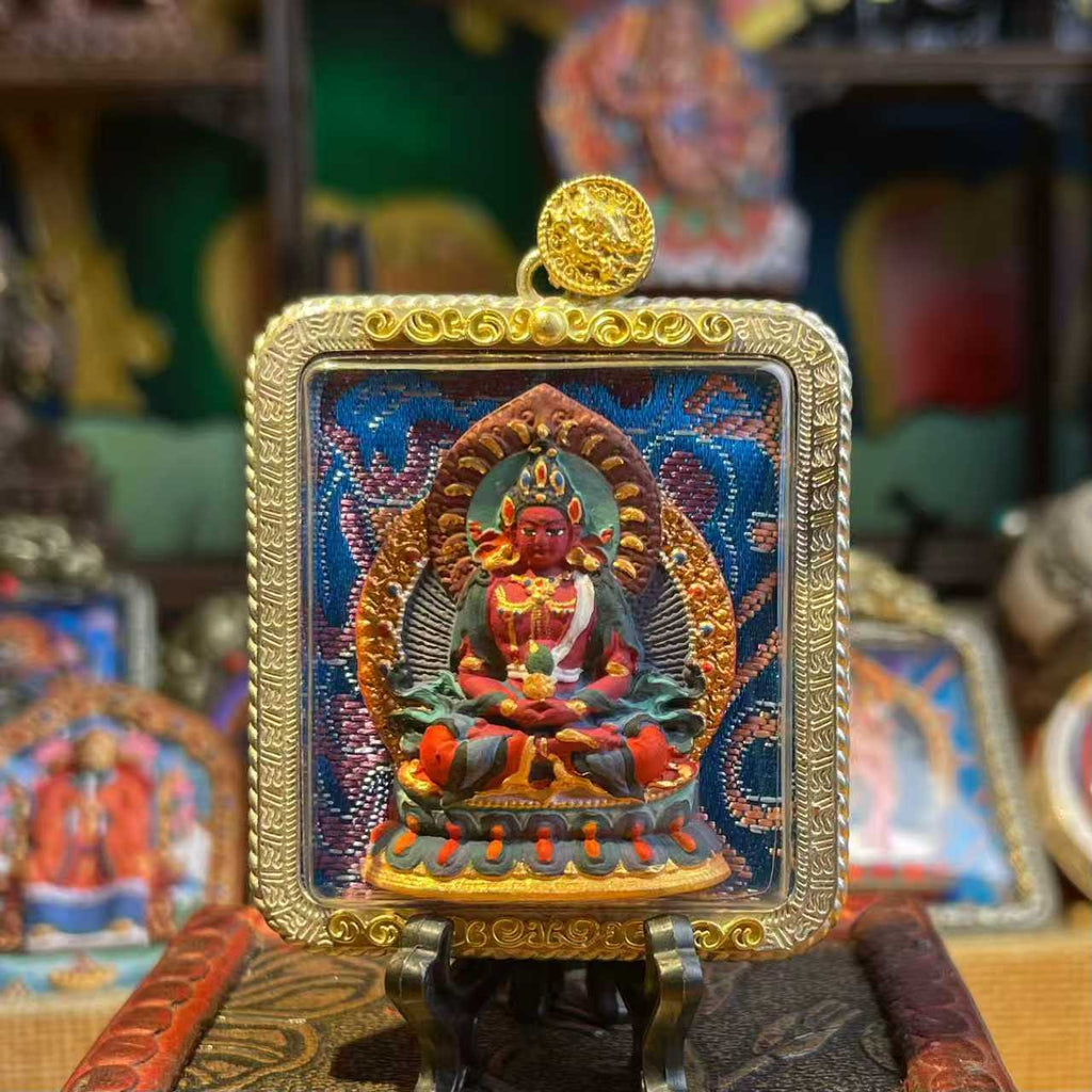 This is a Buddha amulet made of clay by artisans on the roof of the world, fired at high temperatures, and then hand-painted with mineral pigments. Its name is the Buddha of Longevity.